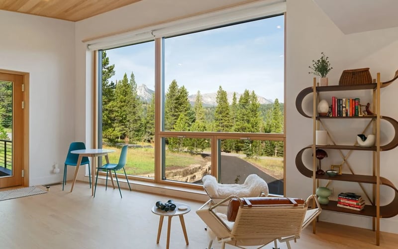 Living area with panoramic mountain views at Bridger Canyon Passive Haus