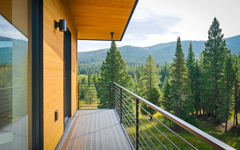 Covered deck with mountain views at Bridger Canyon Passive Haus